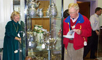 inspecting silver at Stair Galleries Auction
